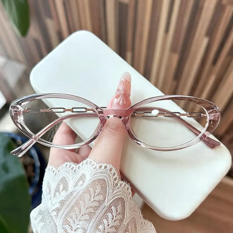 Upgrade your look with these chic oval glasses. Featuring a sleek, translucent frame and unique chain-link temple detailing, these stylish glasses offer a perfect blend of Y2K aesthetic and minimalist sophistication. Ideal for everyday wear or adding a touch of luxe to your outfit. Shop now.
