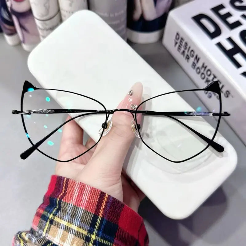 Unleash your dark kawaii vibes with our black metal cat ear glasses! Crafted with lightweight thin wire framing a playful cat-ear silhouette, finished with ornate gothic carved temples. Perfect for anime cosplay, e-girl style & statement everyday wear. Shop today!