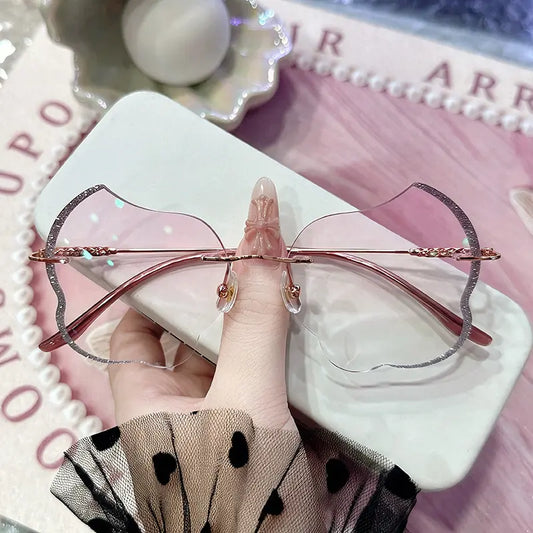 Step into a dream with our whimsical wavy rimless glasses! Featuring stunning pink gradient lenses and a sparkling glitter-edged scalloped silhouette, these unique frames are the ultimate Fairycore or Y2K accessory for your next photoshoot. Shop this statement piece today!