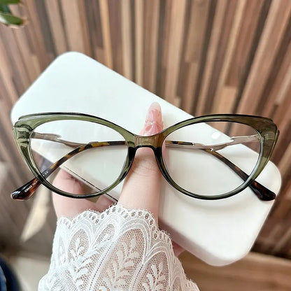 Upgrade your optical style with these vintage-inspired cat eye glasses. Featuring a stunning translucent olive green frame and unique, sculpted temple detailing, these chic frames offer the perfect blend of retro charm and modern sophistication. Shop this statement eyewear now!