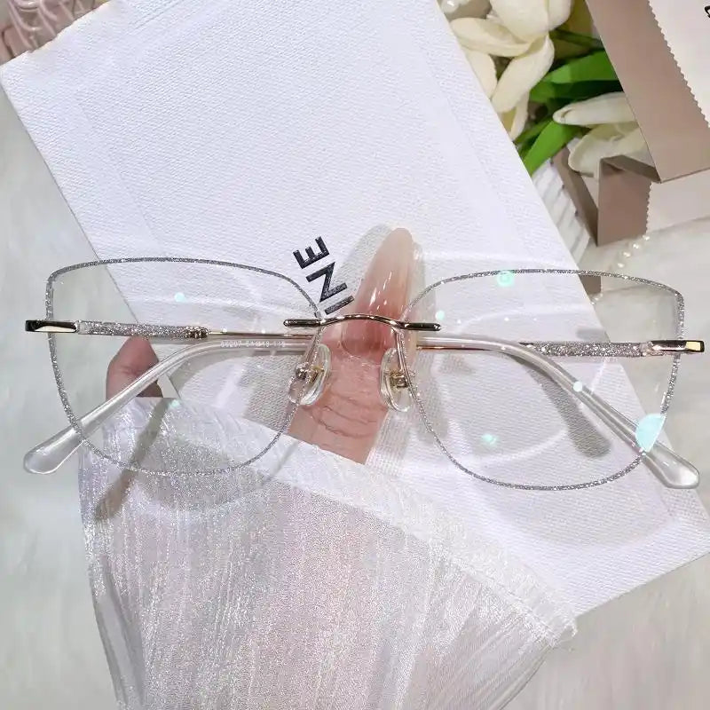 Illuminate your style with our silver glitter rimless square glasses! Featuring dreamy sparkle edge details, an oversized face-flattering shape, and lightweight metal temples. Perfect for Y2K & soft glam aesthetics. Shop now!