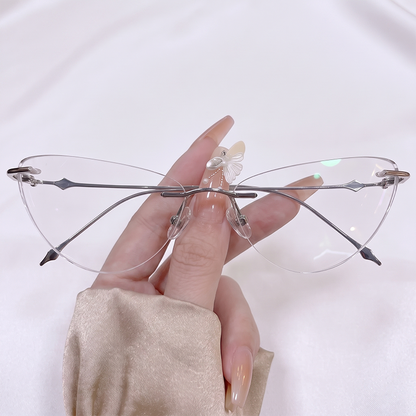 Shop our Y2K rimless butterfly glasses featuring a delicate silver metal frame and clear cat-eye winged lenses. Perfect for fairycore & coquette aesthetic lovers. Free shipping available!