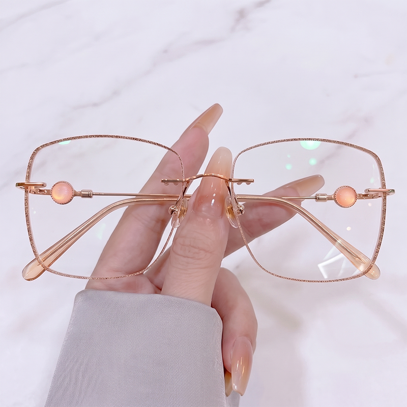 Elevate your gentle romantic style with our rose gold glitter edge rimless glasses! Featuring an oversized soft square silhouette, sparkling glitter border, and charming peach opal bead temple details. Perfect for coquette & fairycore aesthetics. Shop now!
