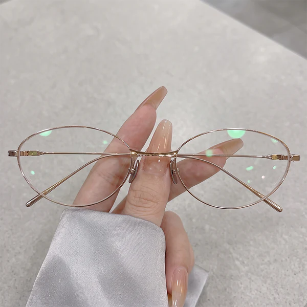 Channel 90s vintage chic with our rose gold oval glasses! Crafted with ultra-thin lightweight metal wire for all-day comfort. Fits office siren, geek chic & clean girl aesthetics seamlessly. Shop now!