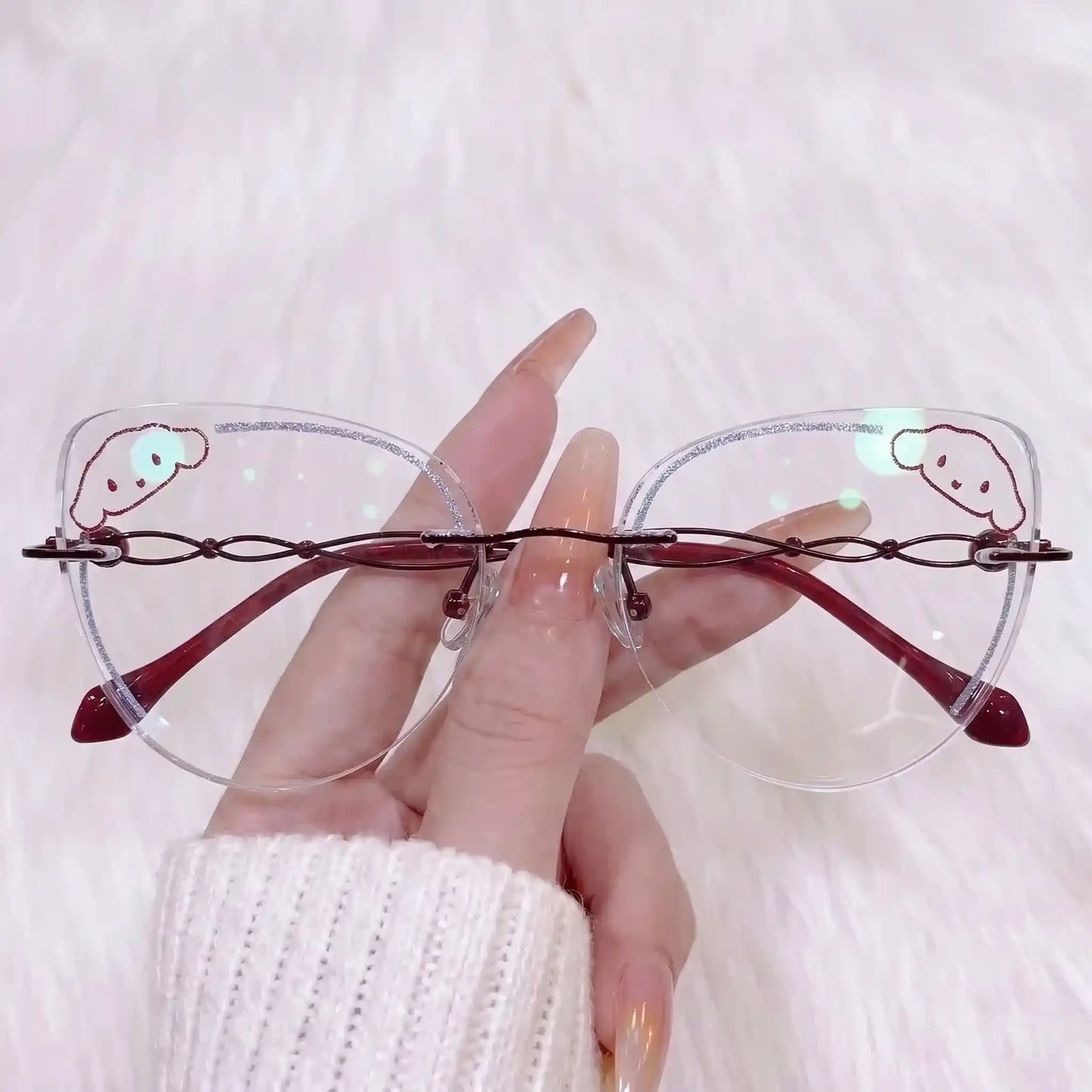 Adorn your look with our kawaii burgundy rimless clear glasses! Featuring a cute cartoon puppy lens detail, sparkly glitter edges, and unique wine-red twisted metal temples. Perfect for Sanrio lovers & Y2K aesthetics. Shop now!